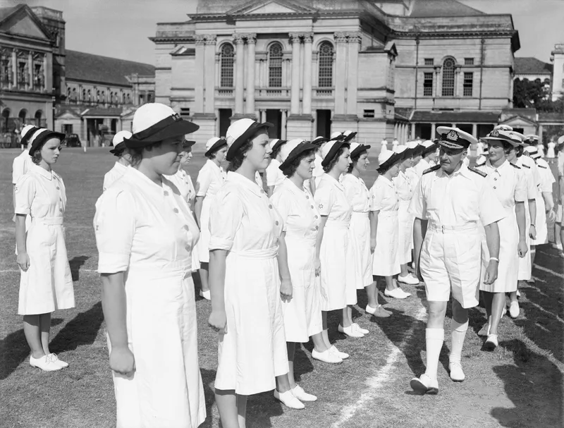Wrens inspected by Admiral Sir James Somerville at Colombo, Ceylon, July 1944. Smoker served in Ceylon as a wireless telegraphist; she is not identified in this photograph.
