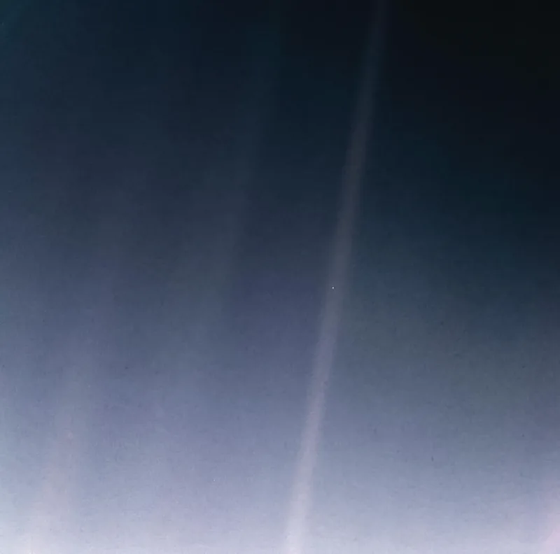 The "Pale Blue Dot": Earth photographed by Voyager 1 from 3.7 billion miles away on 14 February 1990 (the 2020 reprocessing).