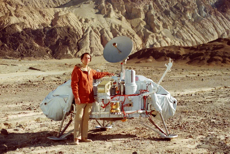 Sagan with a model of the Viking lander, about 1980.