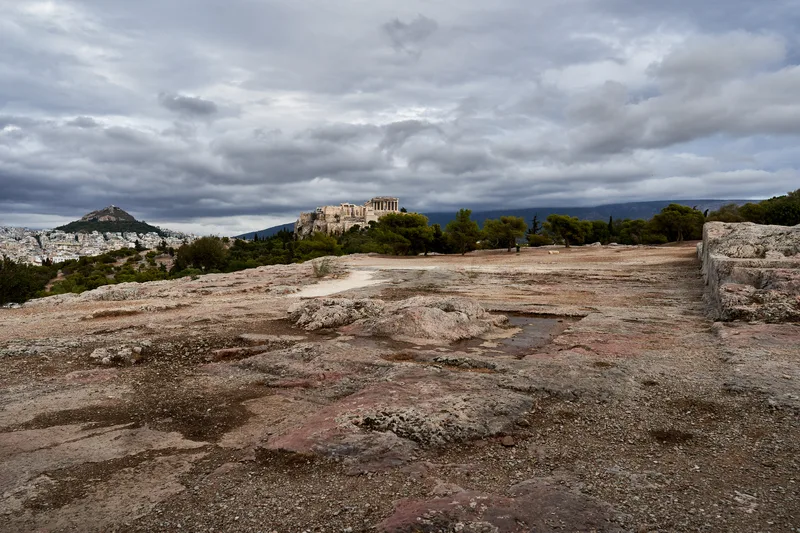 The Pnyx, the hill of the Athenian assembly, with the Acropolis behind.