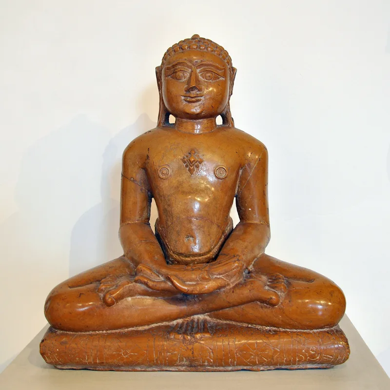Mahavira, the great teacher of Jainism, in a statue made in Gujarat in 1470. Jains revere such liberated teachers; their religion has no creator God.