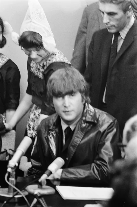 Lennon at the Schiphol press conference, June 1964, the summer his press officer said the Beatles had left their religious upbringing.