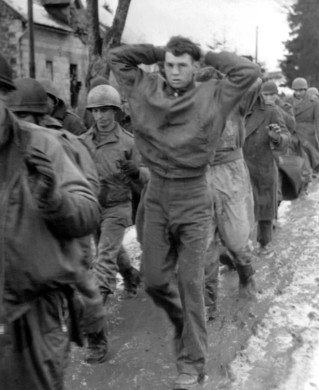 American prisoners marching on the western front in December 1944, during the battle in which Vonnegut was captured. These men are not of his unit.