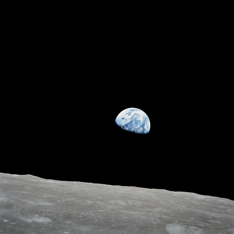 Earthrise, photographed from Apollo 8 on 24 December 1968, the day the crew read from Genesis.