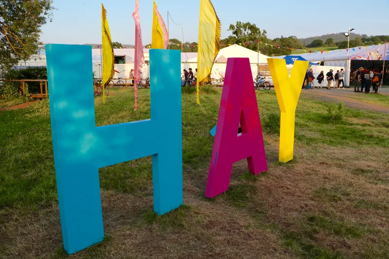 The Hay Festival sign at Hay-on-Wye, in 2016. Fry debated with Christopher Hitchens at the festival in May 2005.