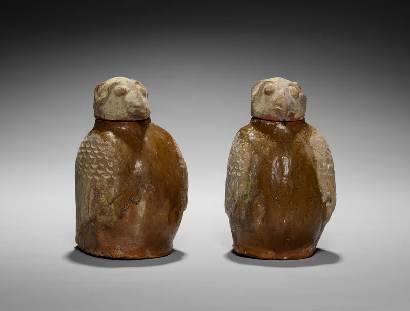 A pair of owl-shaped jars from a Han tomb, in the Cleveland Museum of Art: the kind of grave goods families provided for the dead.